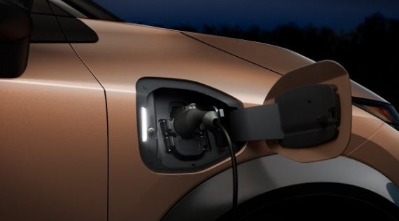 Close-up image of charging cable plugged in | Fort Collins Nissan in Fort Collins CO