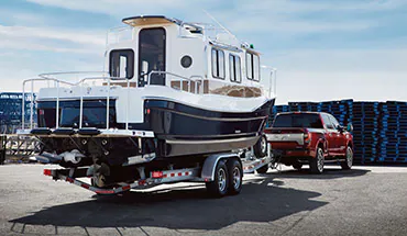 2022 Nissan TITAN Truck towing boat | Fort Collins Nissan in Fort Collins CO